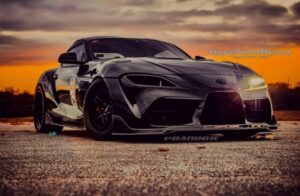 Black Toyota GR Supra A90 with installed dry carbon fiber headlight air duct
